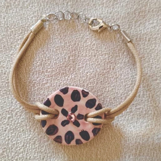 bracciale avana con fiore nero su fondo rosa pesca